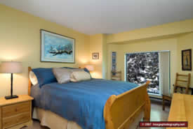 The master bedroom -- where you can rest after a long day of skiing and fun.
