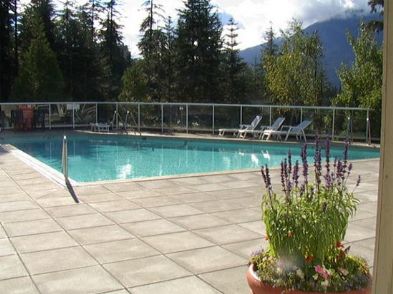 Enjoy the hot tub and swimming pool at Wildwood Lodge